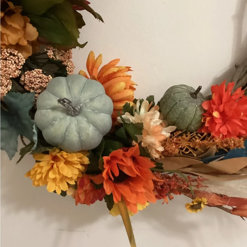 Orange and Green Holiday Wreath with Floral Accents